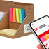 A memo holder in brown cardboard with bright sticky notes in pink, green, yellow, and blue; next to a smartphone.