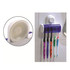 A toothbrush holder with a white and purple design, featuring space for four toothbrushes in various colours.