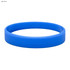 A light blue silicone wristband with a smooth finish and a circular shape, featuring a logo.