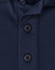 A navy blue polo shirt featuring a button placket and a logo. The fabric is a sustainable poly/cotton blend.