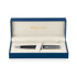 A matte black ballpoint pen in a blue presentation box with a soft interior and a logo.