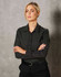 A black ladies' button-up shirt with a pin dot pattern and long sleeves, featuring a logo.