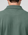 A men's cotton stretch polo shirt in a green hue, featuring a collared neckline and a back view.