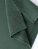 A close-up of a ladies cotton stretch polo shirt in dark green, showing the cuff and stitching details.