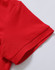 A red polo shirt featuring a textured fabric and a folded sleeve detail. It has a logo on the garment.