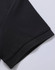 A black polo shirt sleeve featuring a textured fabric and a subtle hem. The garment has a logo on the label.