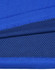 A close-up of blue bamboo charcoal fabric with textured patterns and a visible logo.