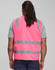 A pink safety vest featuring shoulder reflective tapes and grey stripes, worn by a person from behind.