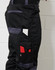A pair of black unisex utility stretch cargo work pants with multiple pockets, including tool holders and a logo.