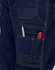 Light weight semi-fitted Cordura work pants in navy, featuring pockets with a pencil and marker visible. Includes a logo.