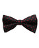 A black bow tie with red polka dots and a logo on the fabric.