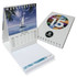 A promotional mini calendar featuring a scenic sailboat image and a colourful design, with a white spiral binding.