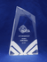 A clear acrylic award with an engraved design, featuring angular edges and a blue background.