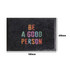 A black nylon logo mat featuring multi-coloured text. Measures 900mm by 600mm.
