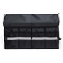 A black storage organiser with a folding lid and several front pockets, featuring silver reflective stripes and handles.