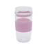 A reusable coffee cup in clear and light pink with a silicone sleeve and a lid featuring a logo.