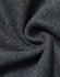 A close-up of dark grey fabric showcasing a soft, fleecy texture with a slight swirl pattern.