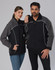 A black and grey reversible jacket featuring a logo, modelled by a man and a woman.