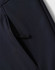 A navy softshell full zip hoodie featuring a zippered pocket on the side and a logo.