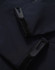 A dark navy softshell hoodie featuring zippered pockets and Velcro closures. It has a sleek and modern design.