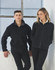 A polar fleece jacket in black, featuring a zip-up front, worn by a man and a woman. The image includes branding.
