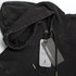 A faded black unisex hoodie featuring a drawstring and logo, with care tags attached.