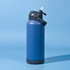 A drink bottle in dark blue with a grey lid and a straw attachment, featuring a logo on the side.
