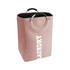A pink laundry basket with a handle, featuring a textured fabric and a black interior. It has a smooth metallic handle.