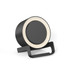 A round black night light speaker with a wireless charging stand. The product features a light ring around the top edge.
