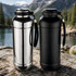 A drink bottle set featuring a shiny silver and a matte black design, both with a carrying strap and lid.