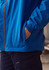 A blue unisex super light packable rain jacket with pockets, featuring a logo on the side.