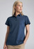 A woman models a navy blue short sleeve polo shirt with a collar and a logo on the chest.
