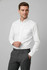 A white long sleeve button-up shirt with a pocket, paired with grey trousers. The shirt features a logo.