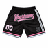 Sublimated crafted basketball shorts in black with pink accents and a logo, featuring a sporty design and stripes.