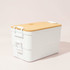A double stack lunch box in white with a bamboo lid, featuring two compartments and a branded logo.