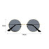 Retro round sunglasses featuring a gold frame and dark lenses, measuring 14 cm wide and 5 cm high.