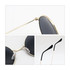Retro round sunglasses with black lenses and a gold frame, featuring clear nose pads and sleek black arms.
