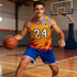 A sleeveless sport jersey in red, yellow, and blue, featuring a logo and worn by a male model on a basketball court.