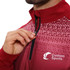 A maroon quarter-zip raglan jacket with a stand-up collar, featuring a logo. The design includes a patterned gradient.