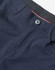 Navy blue flexi chino pants featuring a button closure and a stylish waistband. The fabric appears smooth and durable.
