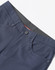 Navy flexi chino pants featuring a button closure, pockets, and a contrasting waistband. Includes branding.