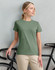 A ladies' premium cotton short-sleeve tee shirt in olive green, paired with a bicycle in the background.