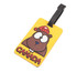 A yellow luggage tag featuring a cartoon bear wearing a red beanie, with "CANADA" displayed in bold letters.
