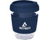 A reusable coffee cup in clear glass with a navy blue silicone lid and band, featuring a logo.