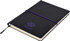 A black A5 notepad with a purple elastic band and logo on the cover, featuring plain pages.
