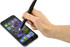 A black stylus pen held in a hand, touching the screen of a smartphone displaying a floral background.