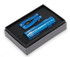 A blue flashlight and multi-tool are displayed in a black gift box with a foam insert. The box has a simple design and contains a logo.