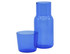 A blue glass carafe with a matching tumbler, featuring a simple design and a logo on the surface.