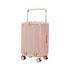 A hardside suitcase in pale pink, featuring a textured surface, retractable handle, and four wheels for easy movement.
