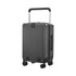A grey hardside suitcase with a retractable handle and four wheels, featuring vertical grooves and a brand logo.